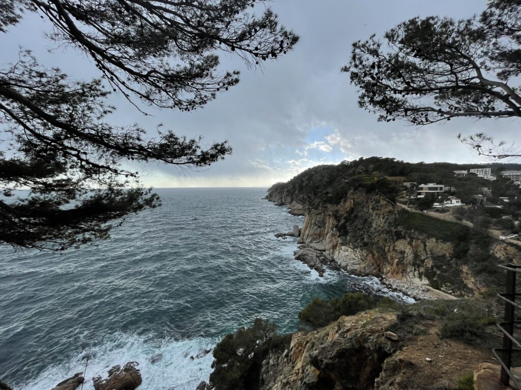 A picture from Tossa de Mar coast, a beautiful village near Girona, Spain.View is from a clifftop looking along the cliff as it goes out into the ocean.