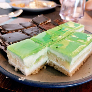 Green and brown pastry bars shaped like brownies.